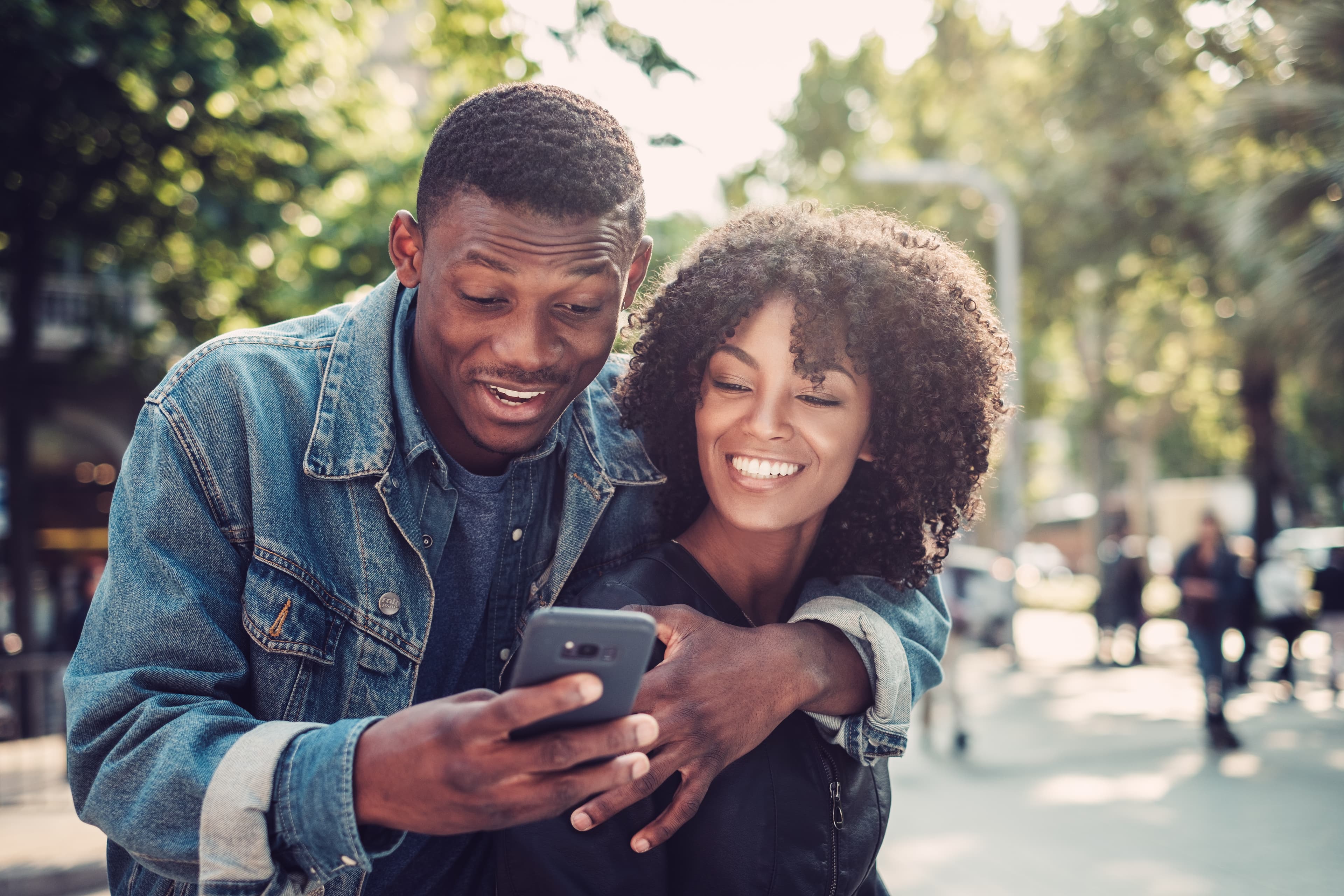 Young couple looking at a smartphone together