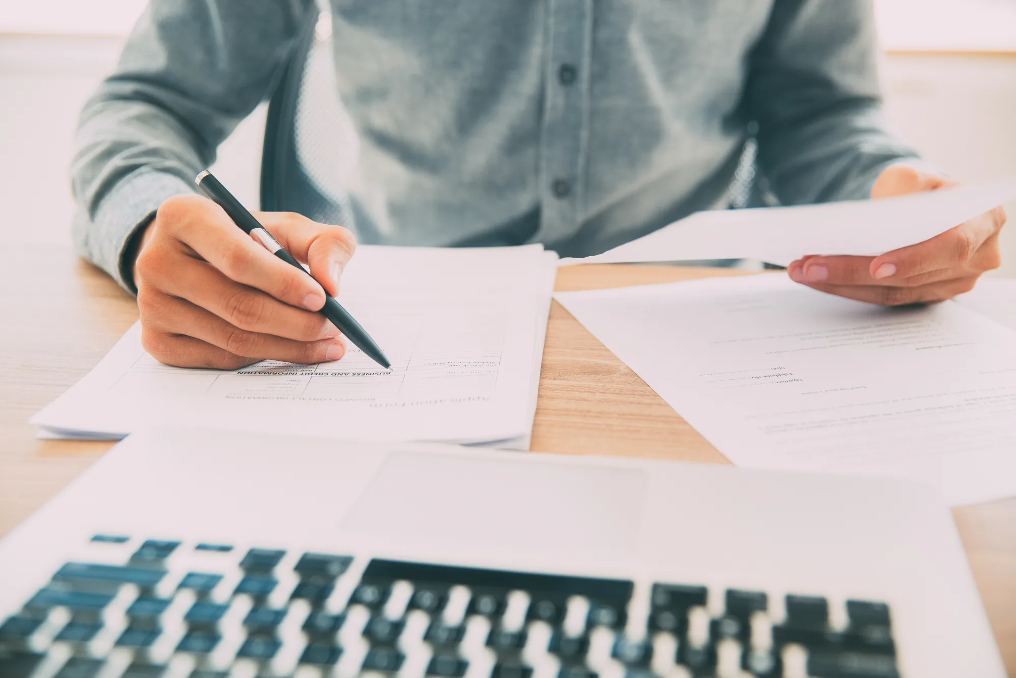 Person reviewing legal documents at a desk
